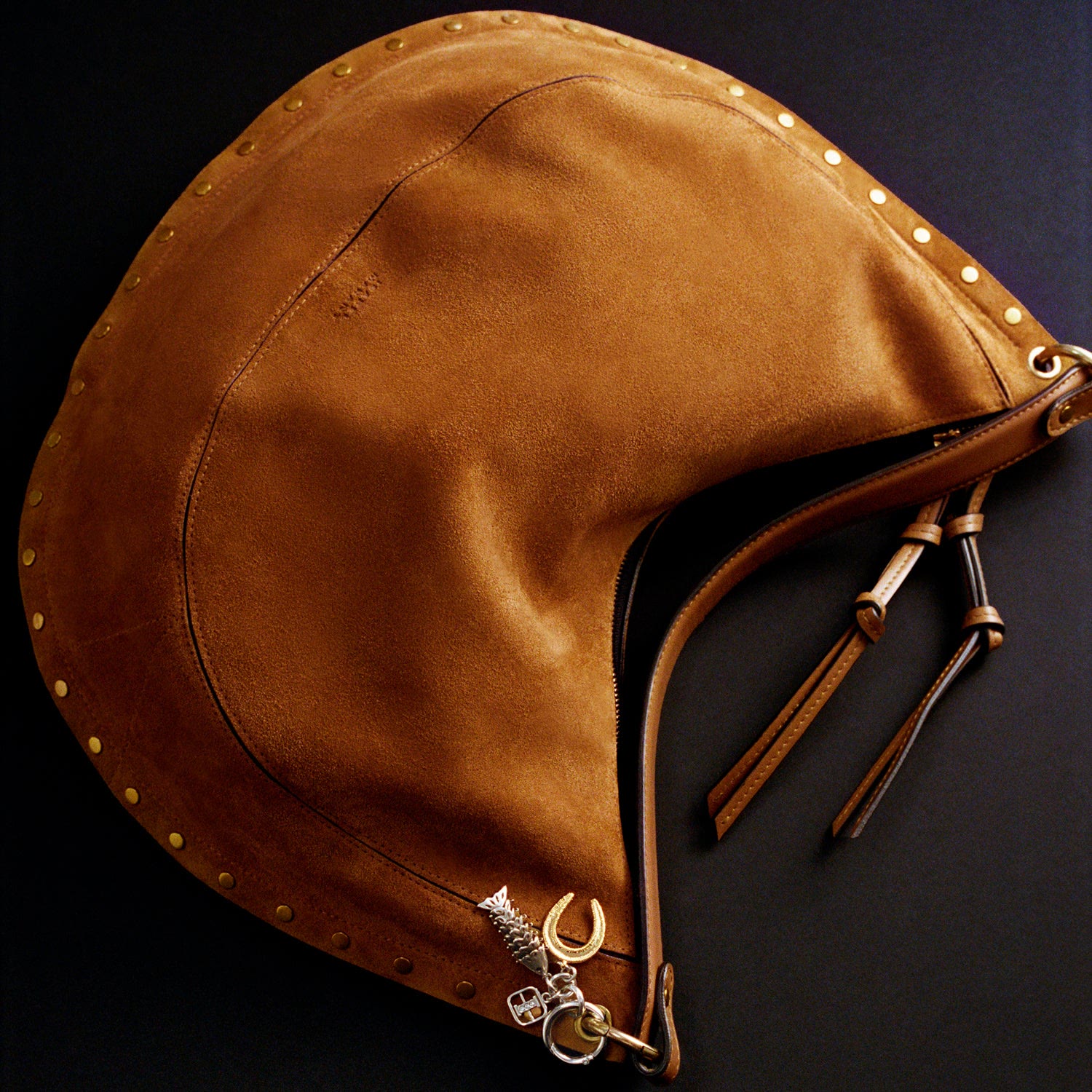 Cognac suede with studs and a charm