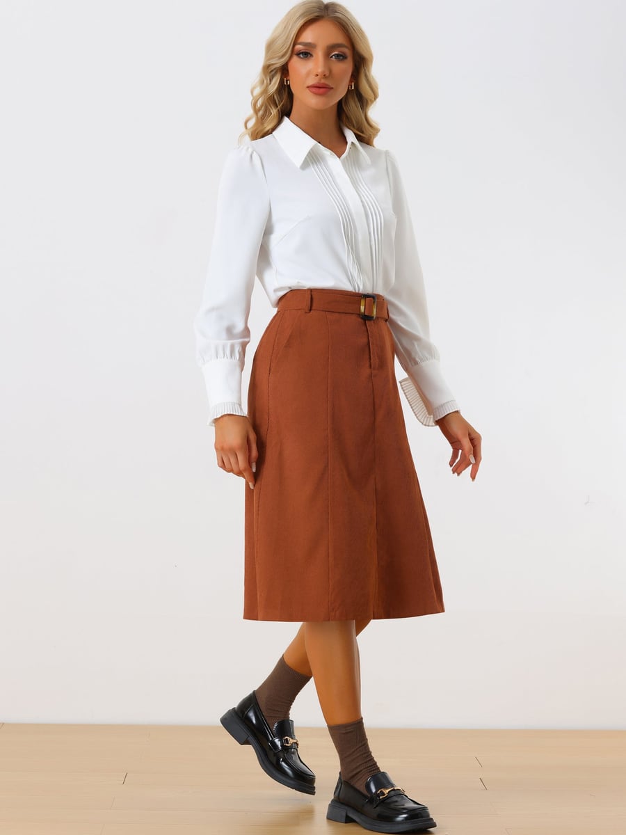 Full length, walking in the caramel skirt and a white shirt