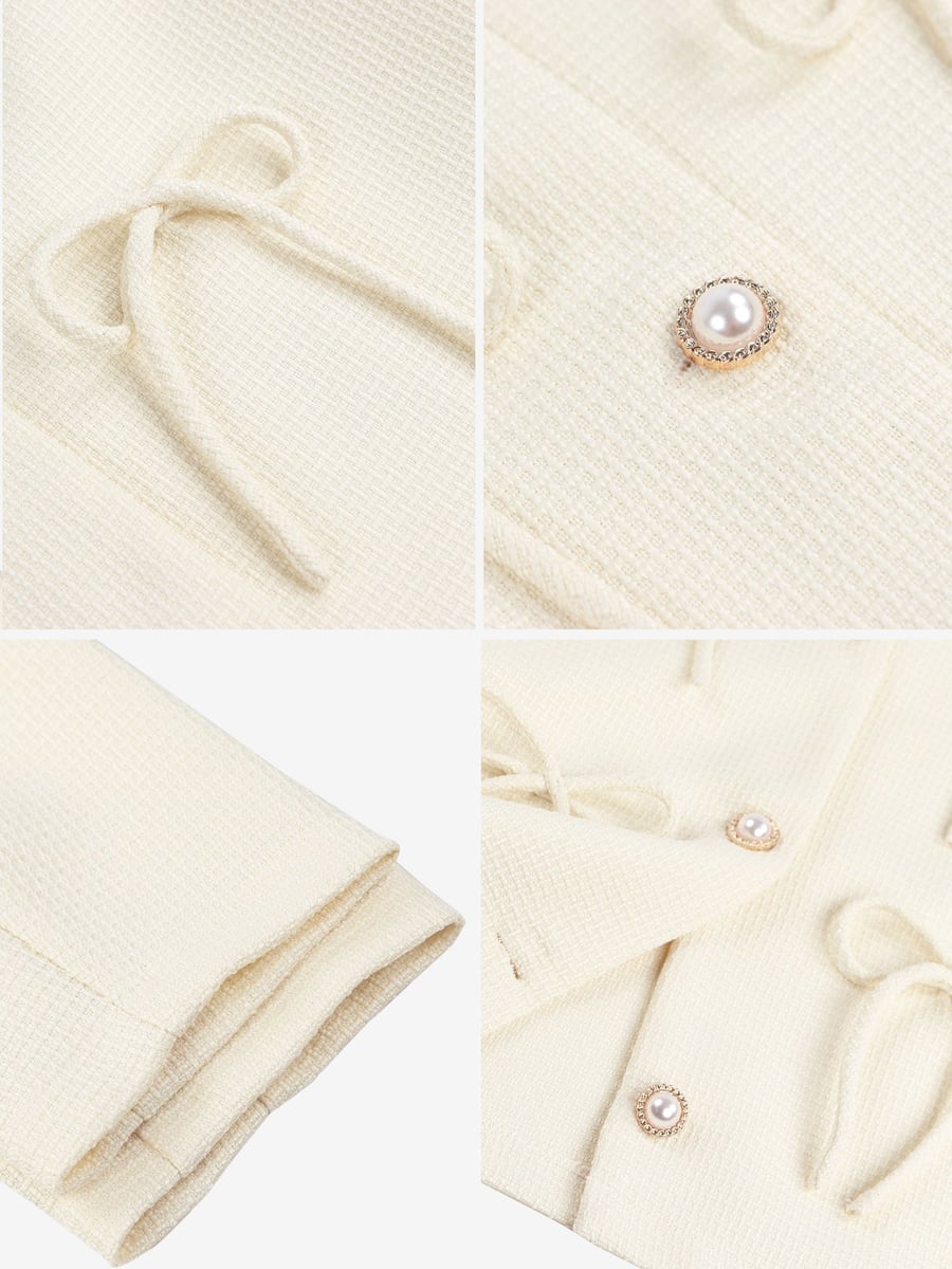 Close-ups of the bow, button and cuff
