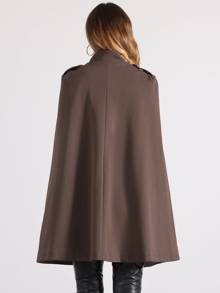 Back view, the cape falling from the shoulders