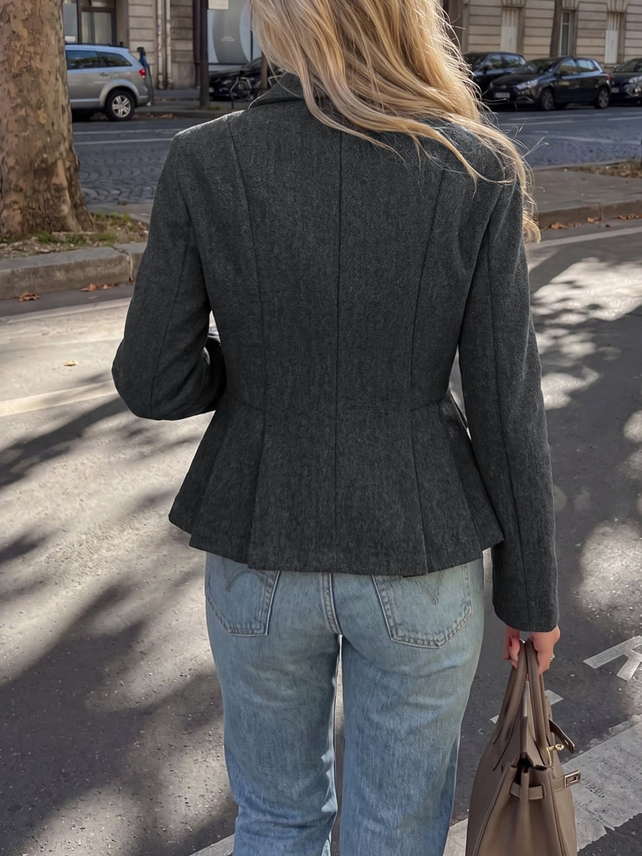 Back view showing the peplum pleats