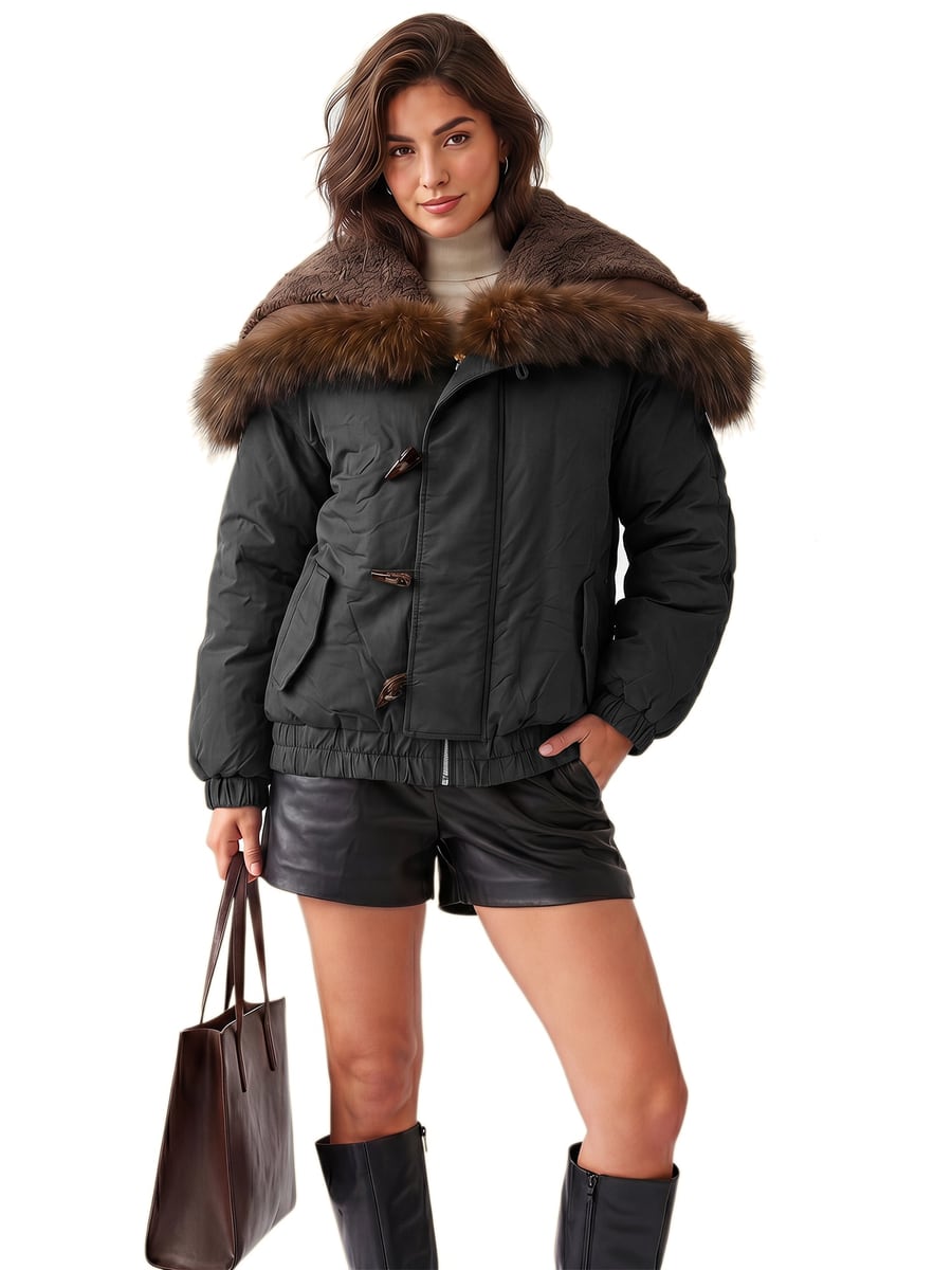 Front view, black puffer with a hand in the pocket