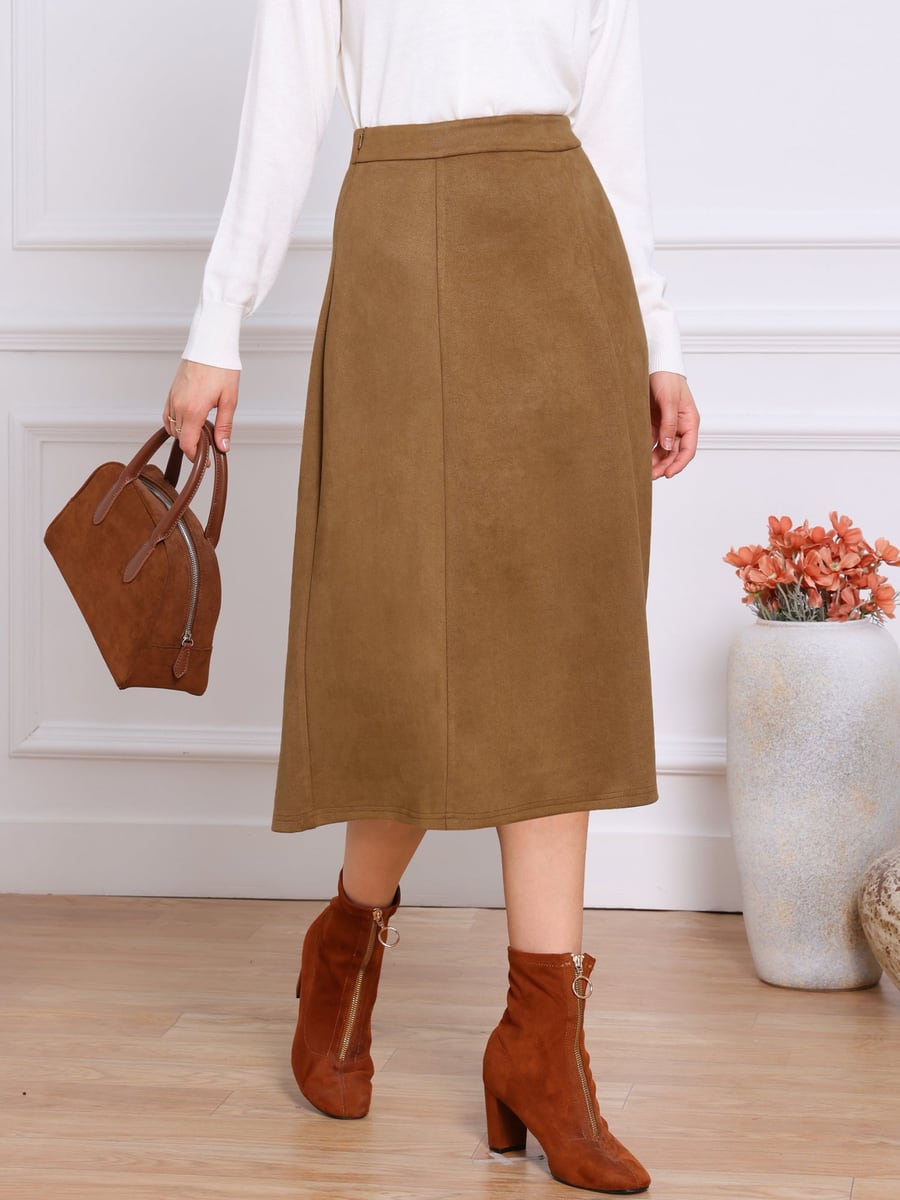 Front view, brown skirt with a white knit and boots