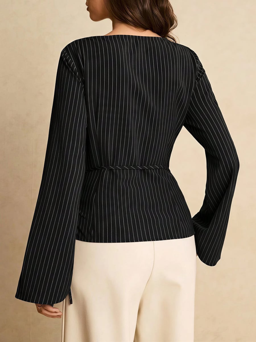 Back view showing the flared sleeves