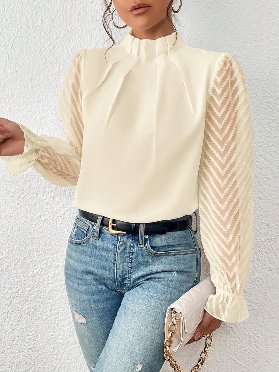Showing the sheer sleeve and ruffled cuff