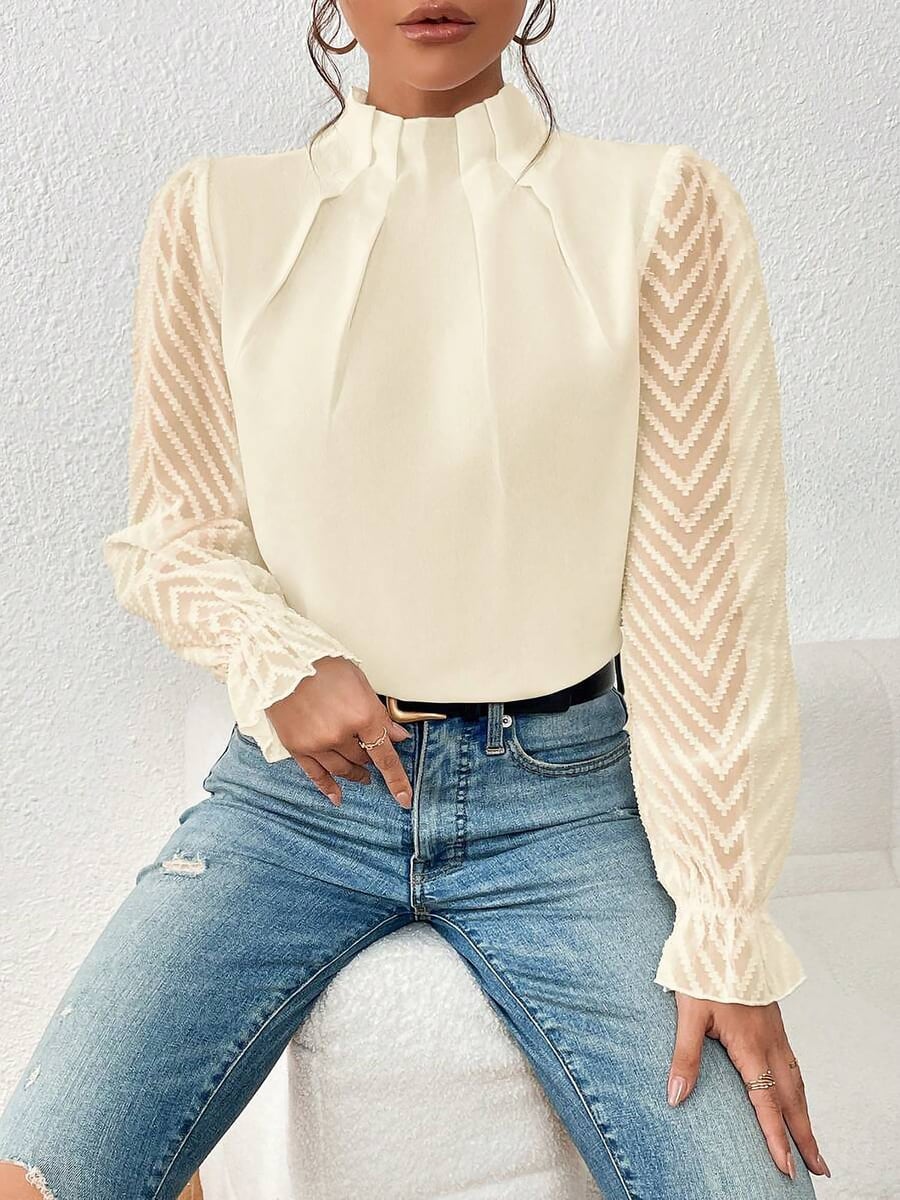 Seated, styled with jeans