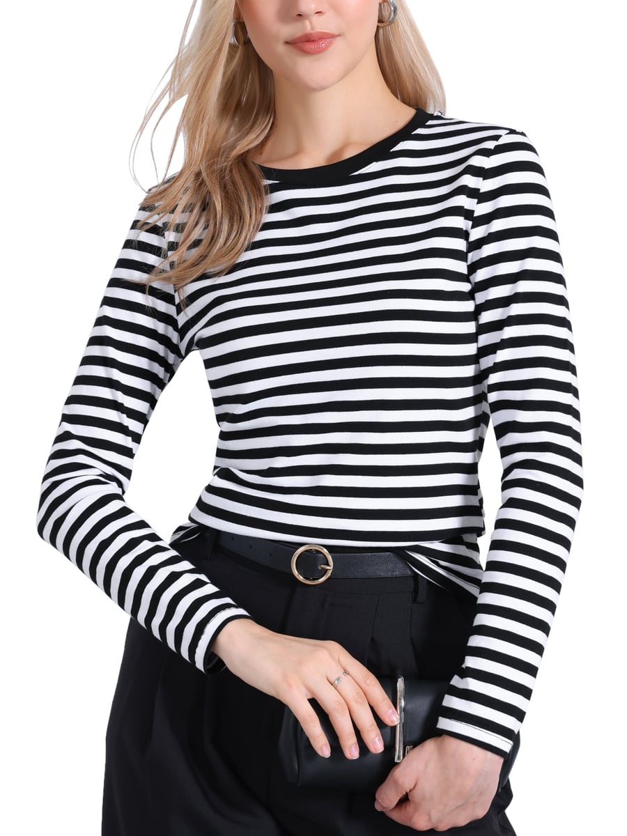 Tucked into belted trousers