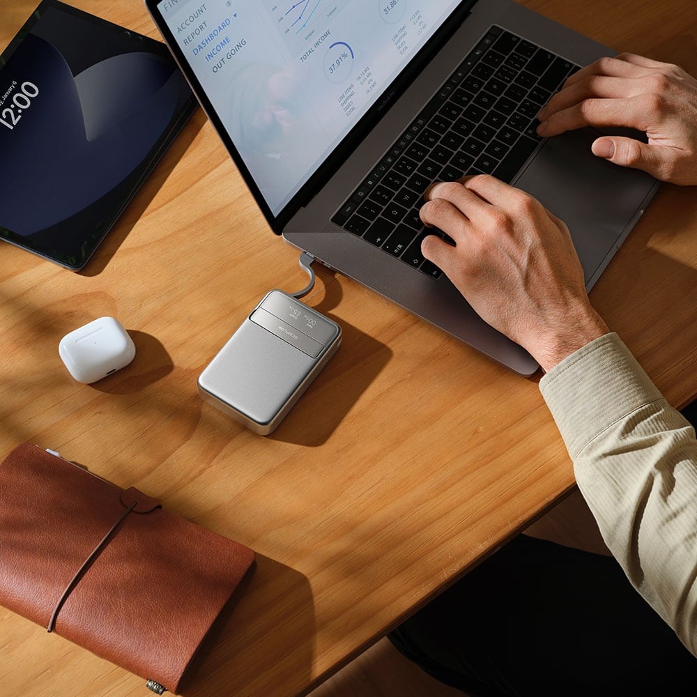 On a desk beside a laptop