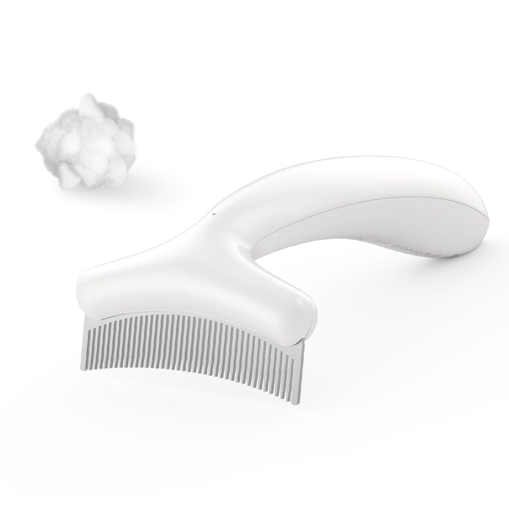 The comb beside a tuft of brushed-out fur