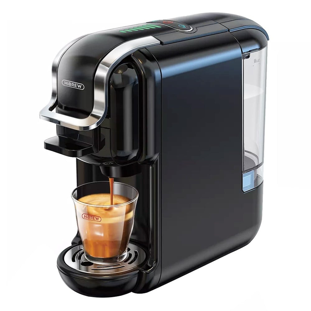 The black machine brewing espresso into a glass