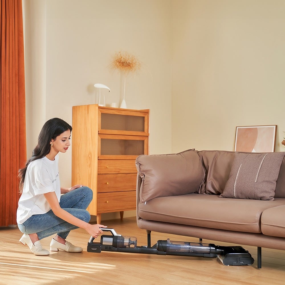 Lying flat at 180° to clean under a sofa