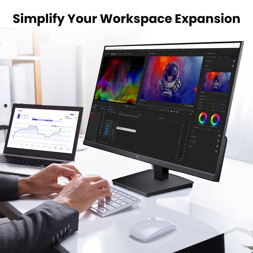 Editing video next to a laptop