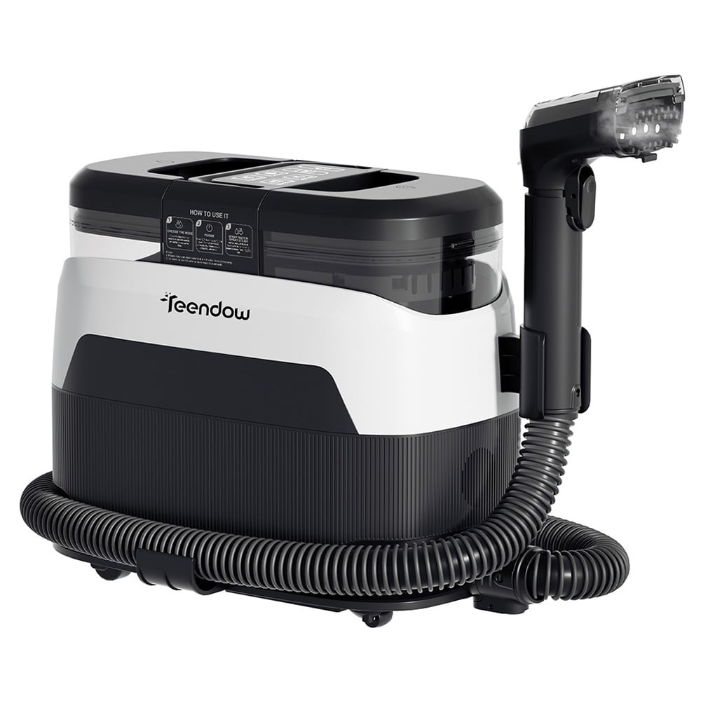 The white unit with its hose and hand tool