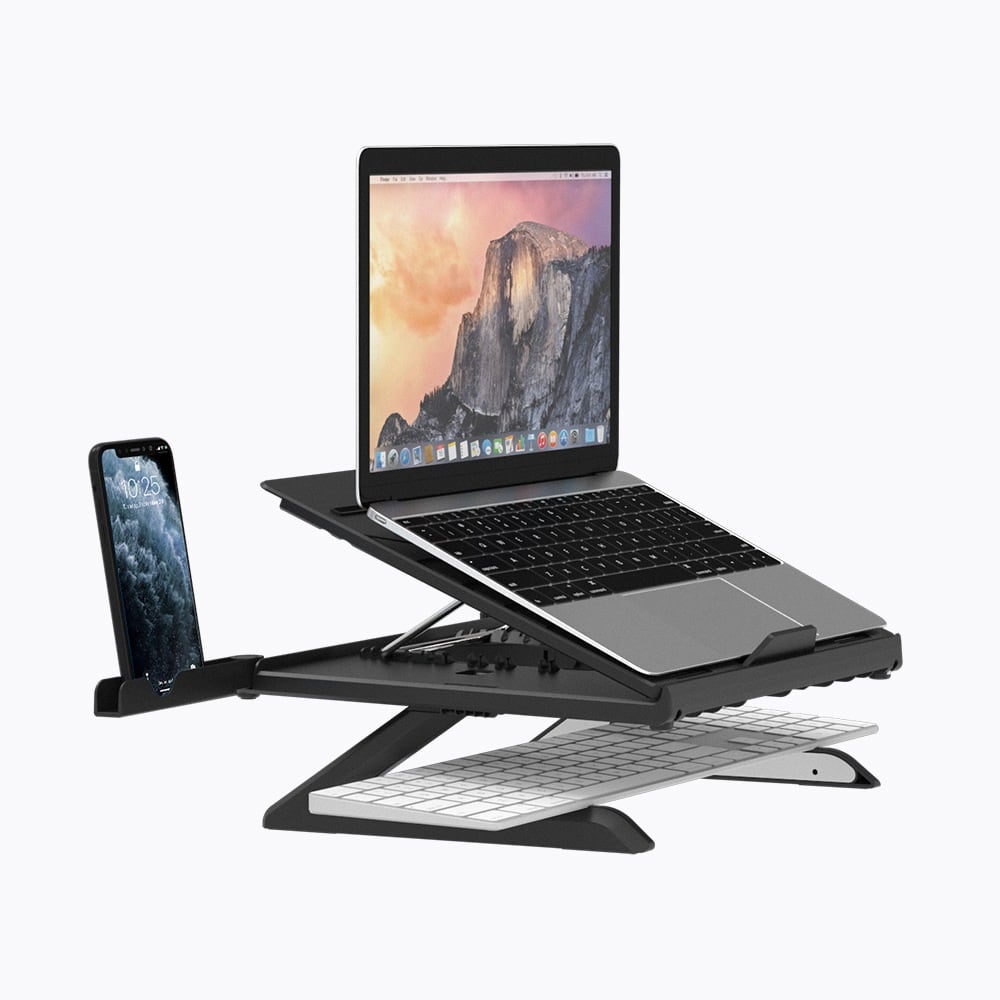 Holding a laptop and a phone