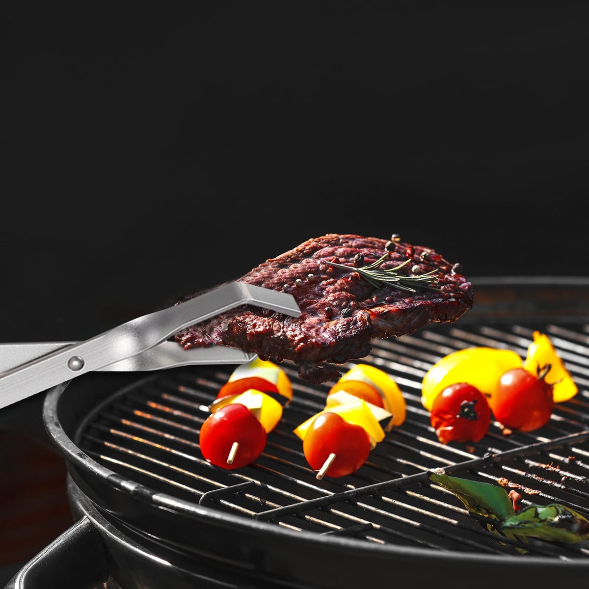 Picking up meat on a grill