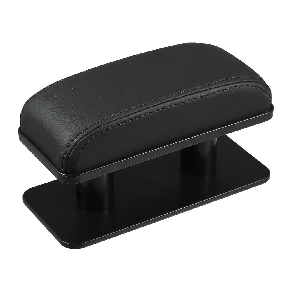 The black faux-leather armrest