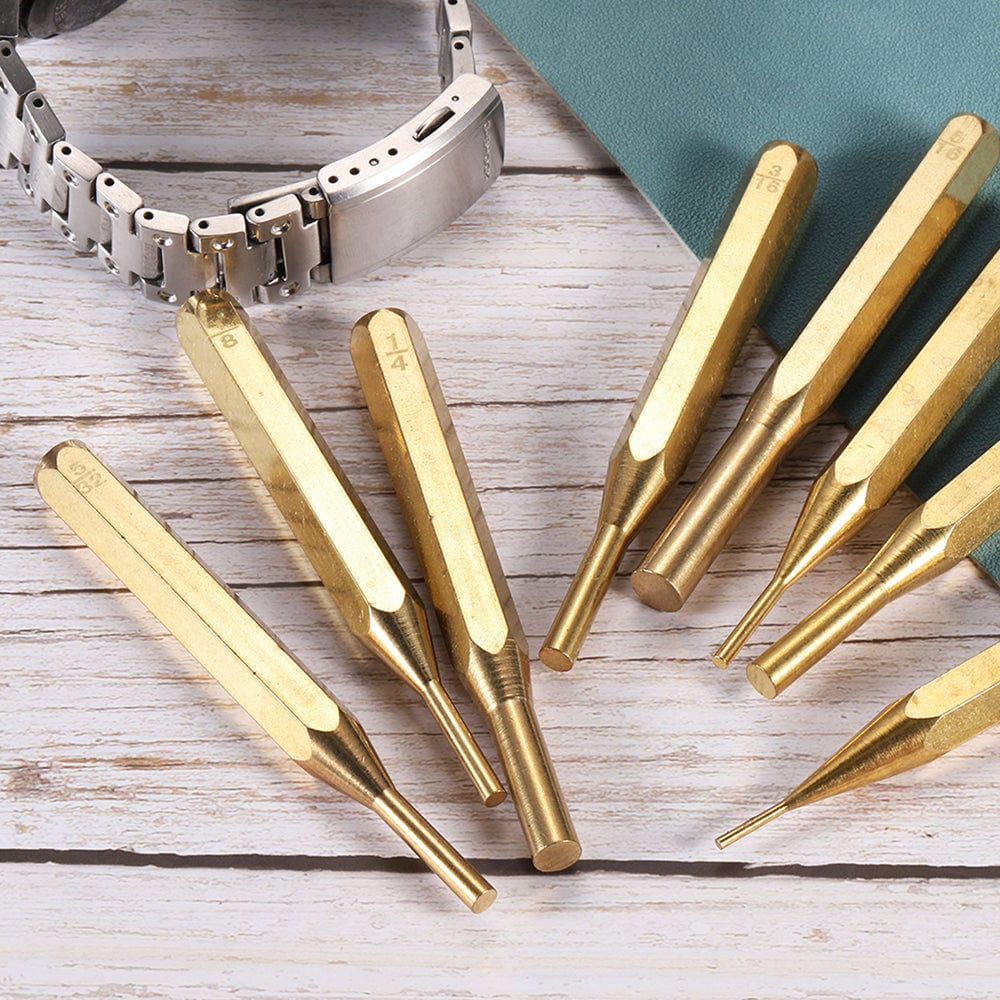 Punches beside a watch band