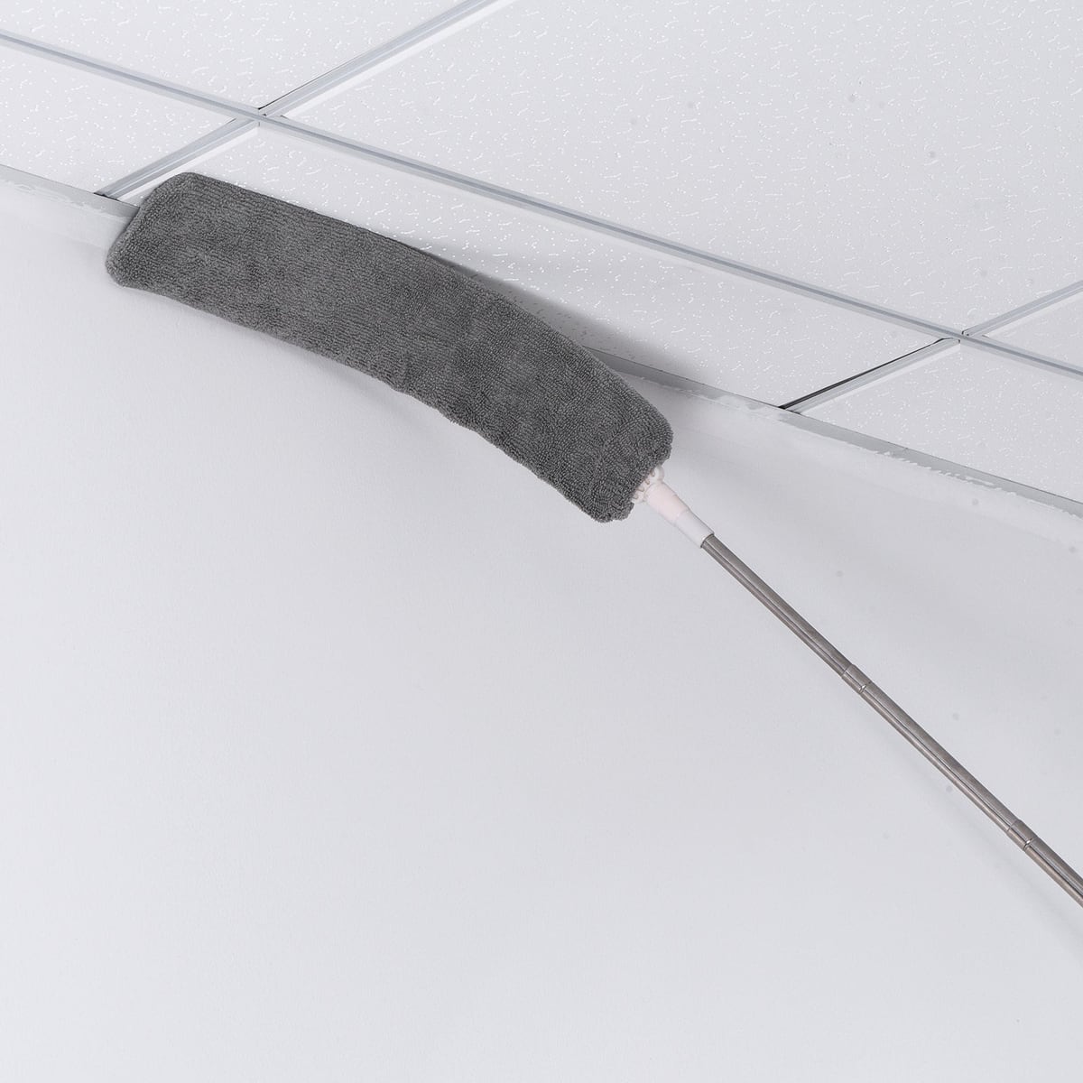 Dusting a ceiling corner