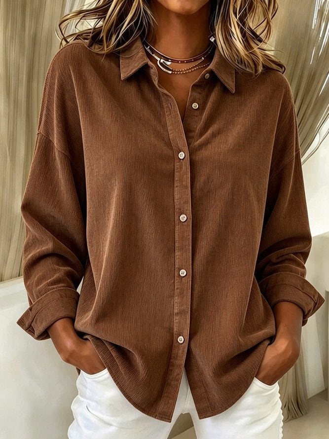 Brown shirt with white trousers