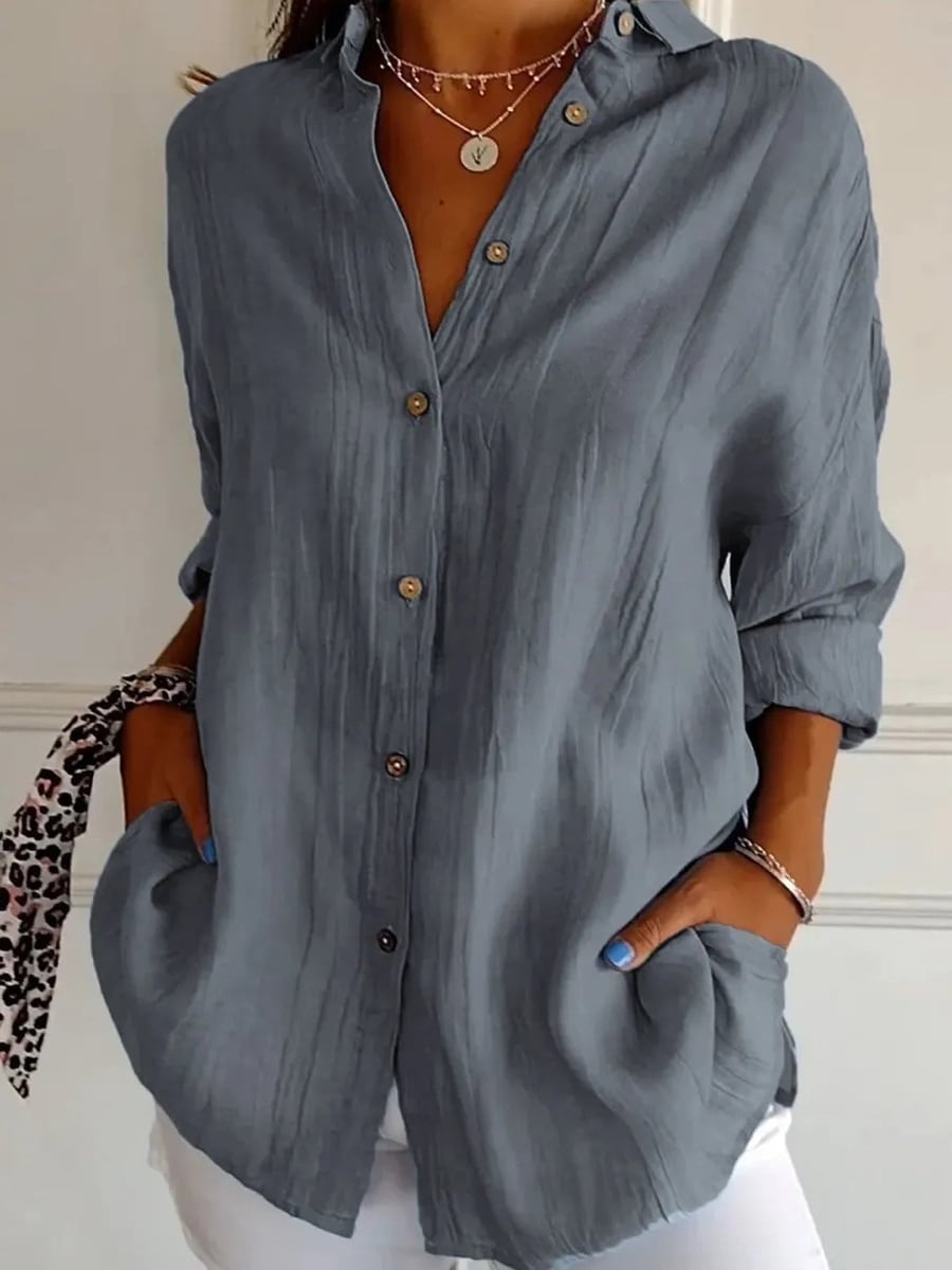 The shirt in gray, worn