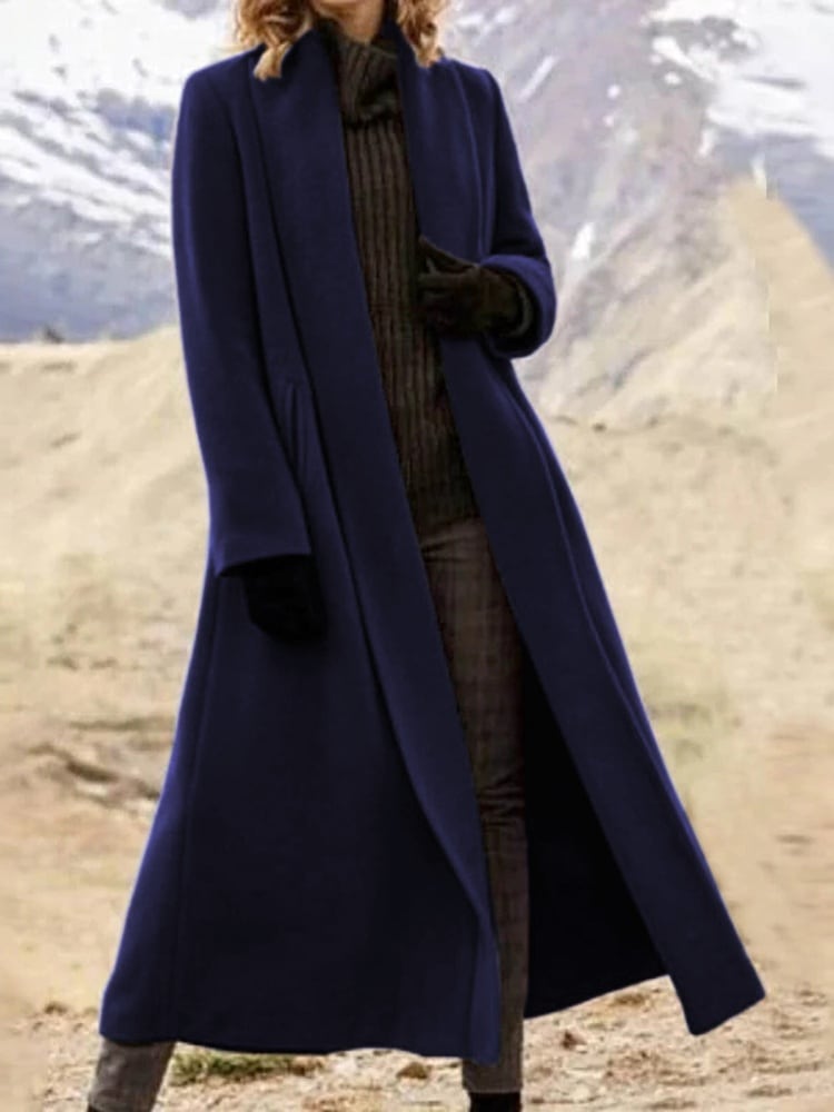 The coat in deep blue, worn