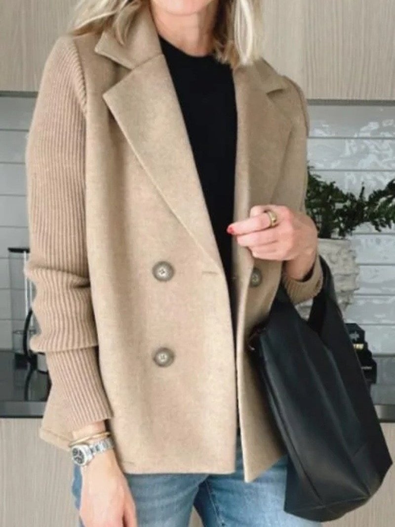 The beige coat with a black tote