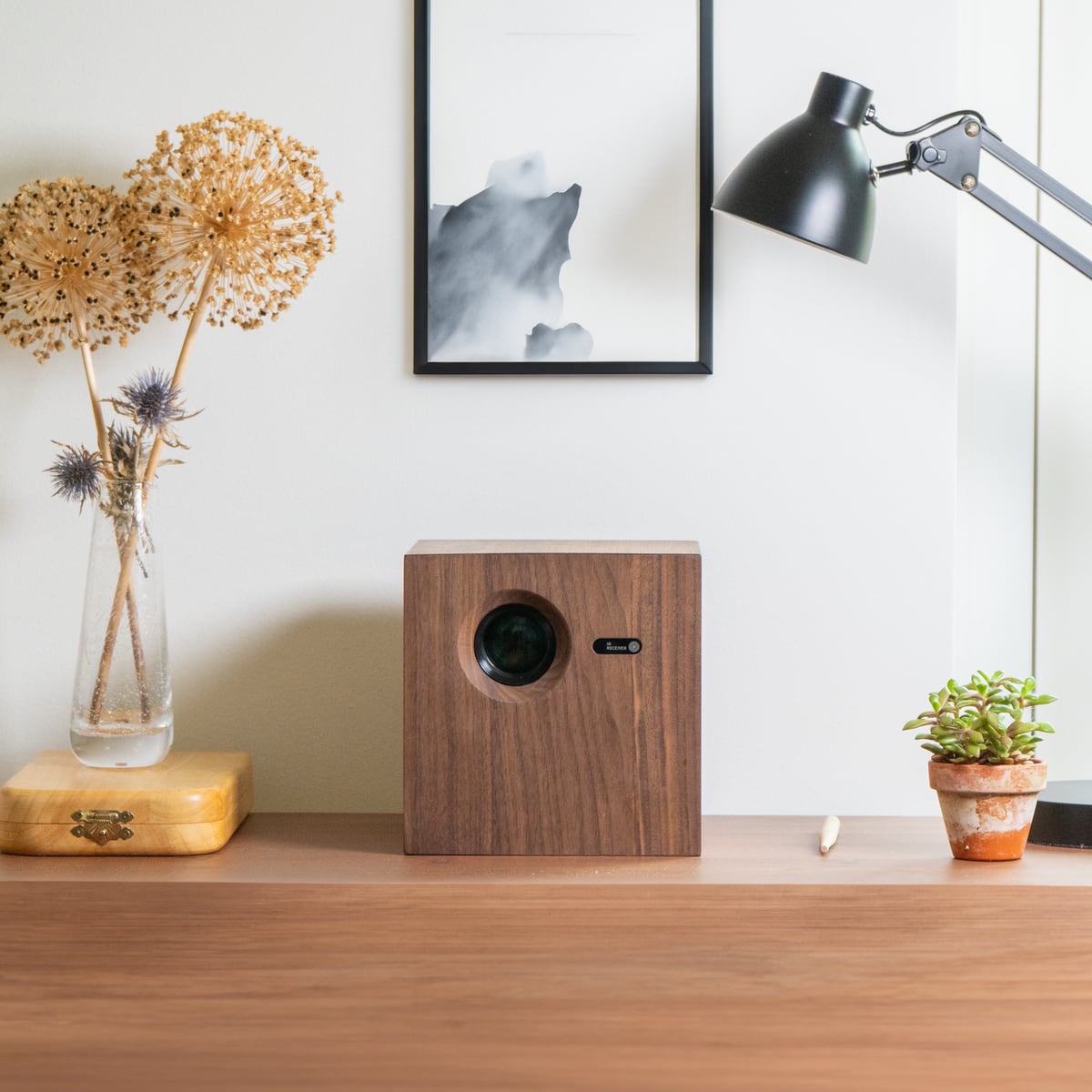 Walnut projector on a sideboard