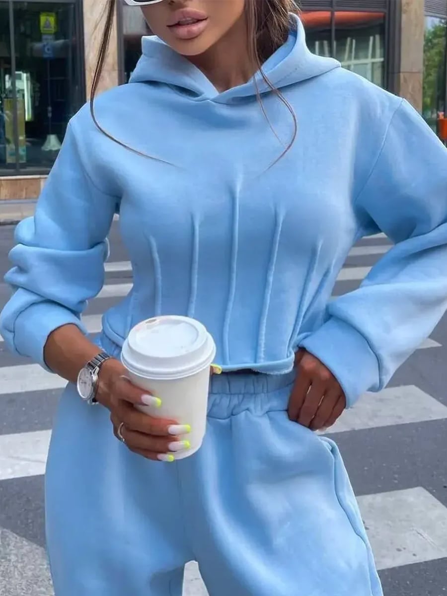 Front, holding a coffee