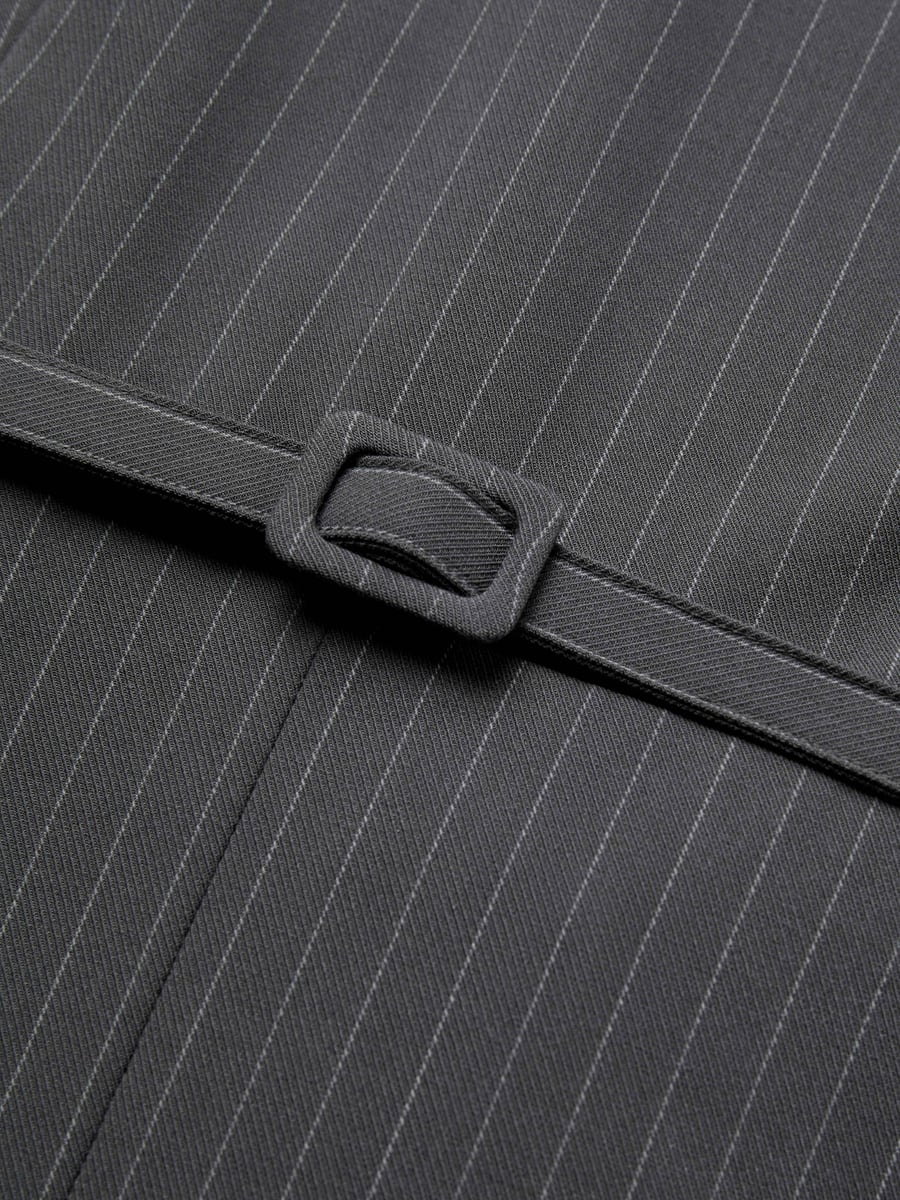 Close-up of the belt buckle and stripe