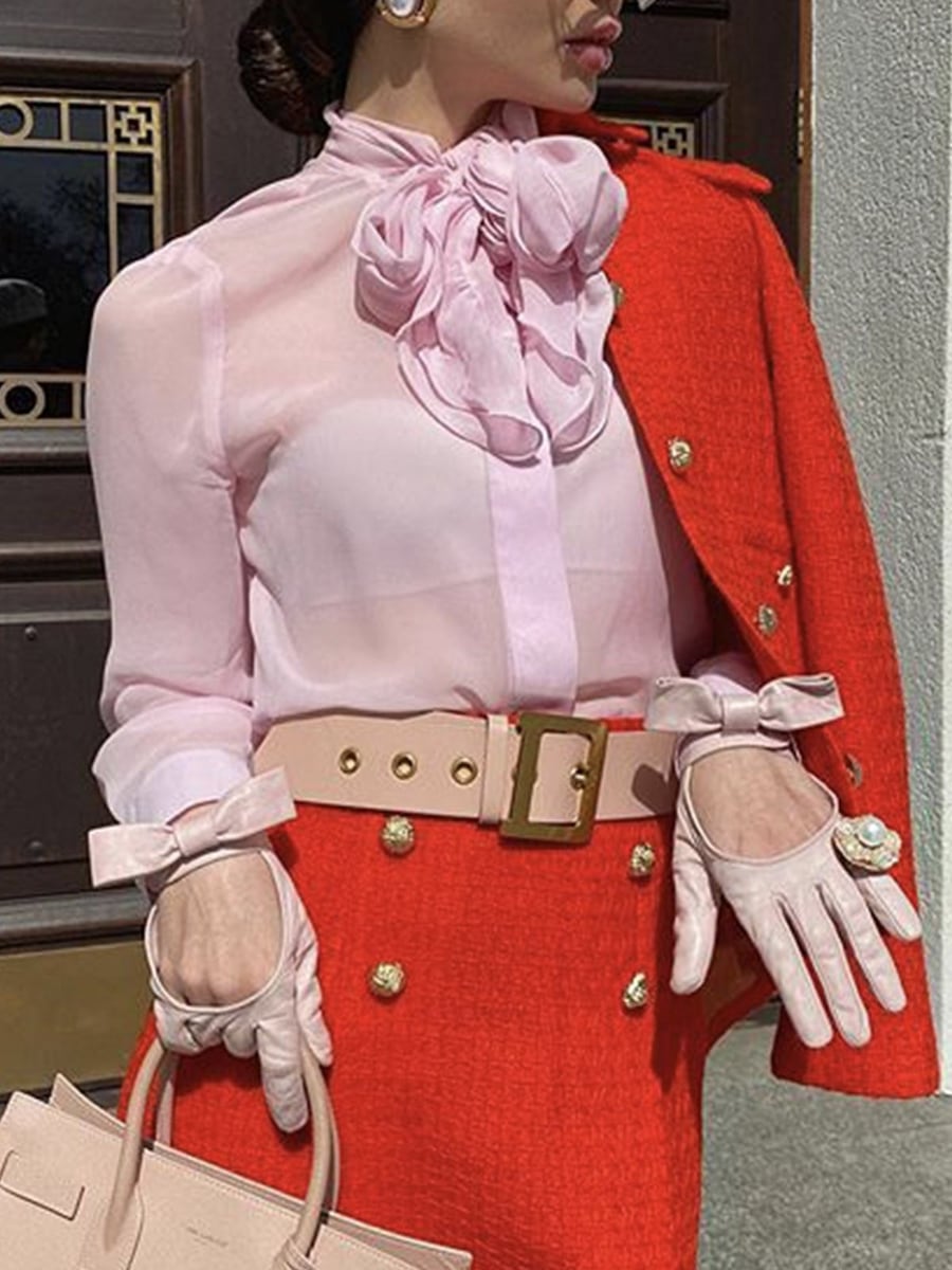 Upper body, with a matching red skirt
