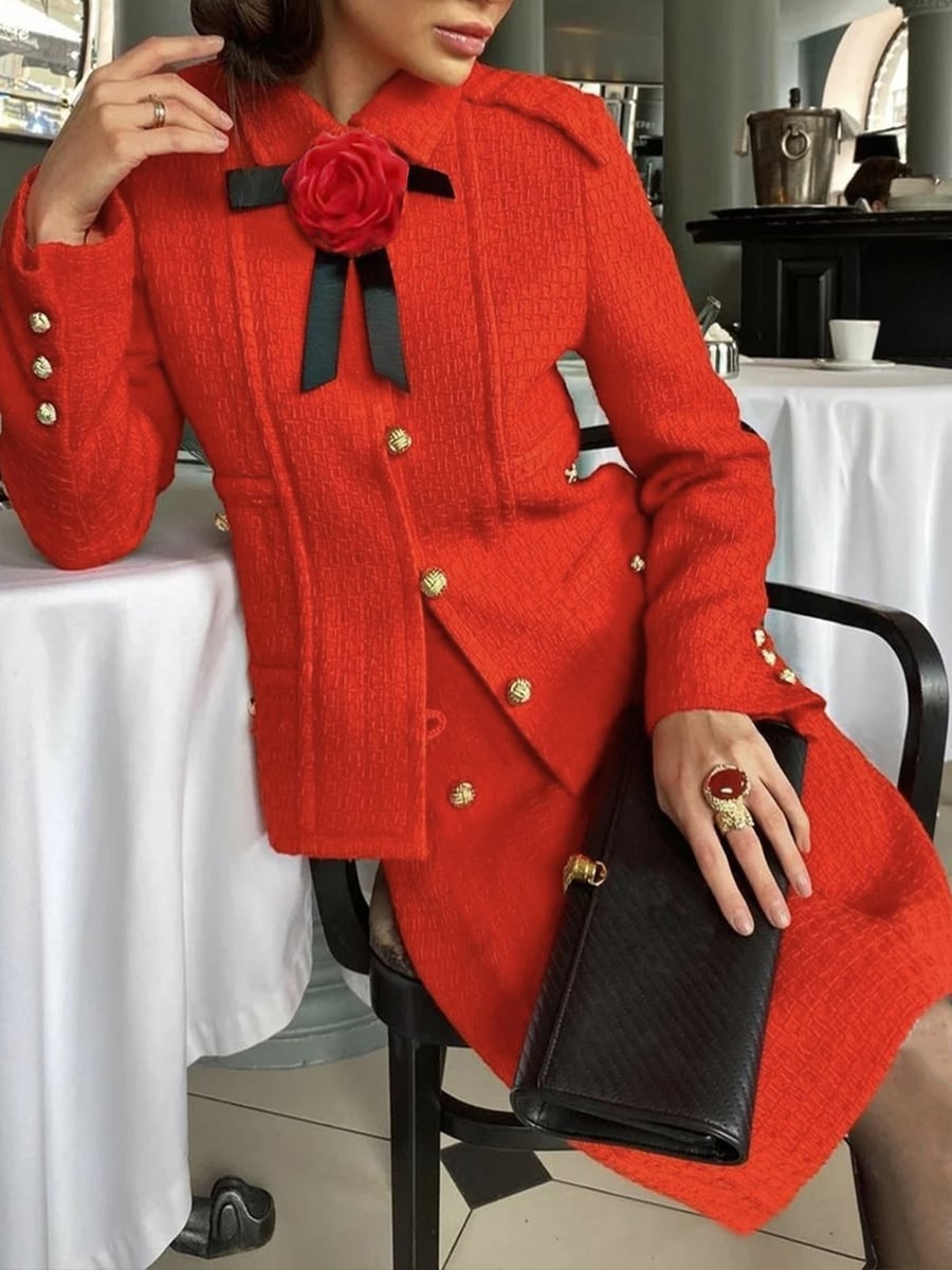 Seated, with the brooch pinned on