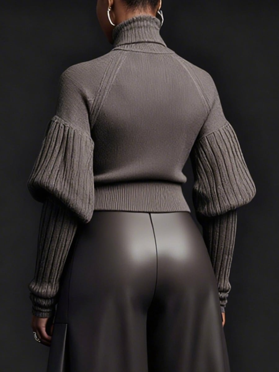 Back view showing the puffed sleeves