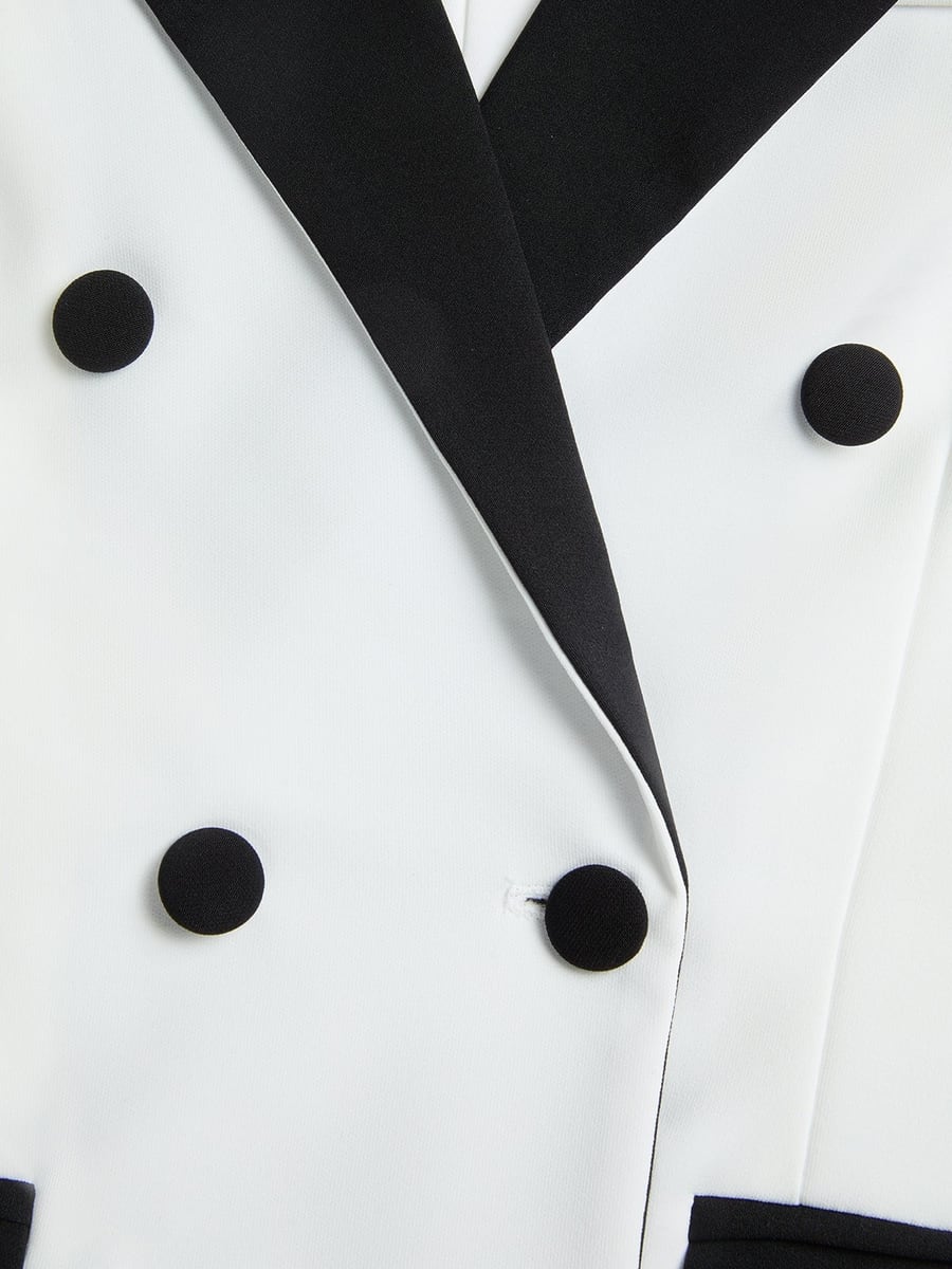 Close-up of the black lapel and buttons